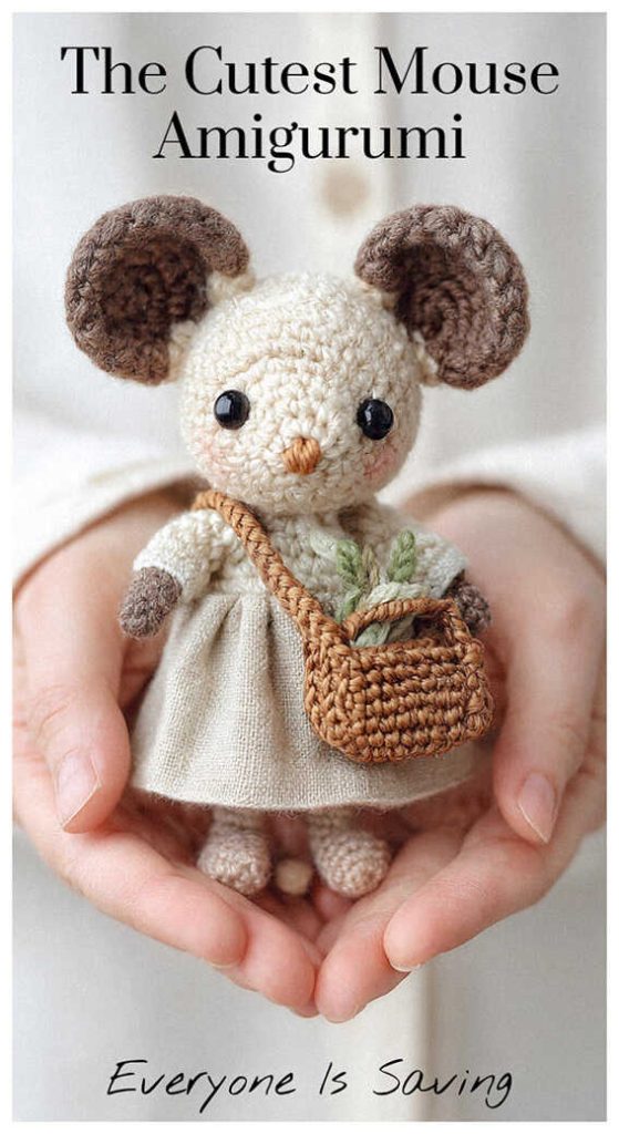Adorable mouse amigurumi with small basket held in hands, styled as a handmade crochet plush toy for nursery decor or sweet gift idea.