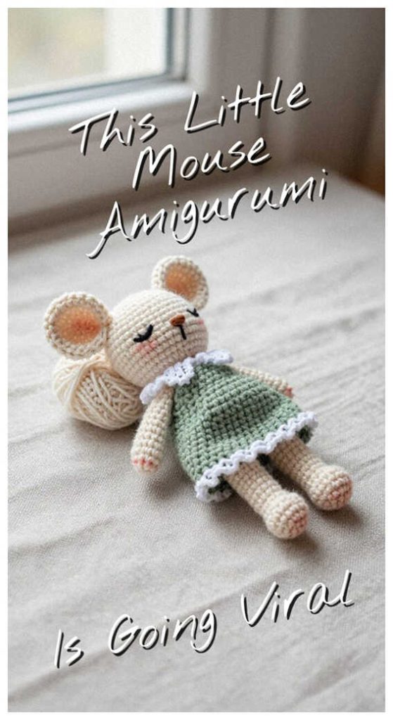 Little mouse amigurumi lying beside yarn ball on bed, styled as a cute handmade crochet plush toy for nursery decor or baby shower gift idea.