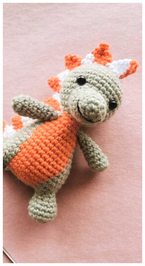 colorful baby dinosaur amigurumi crochet toy cute handmade plush nursery gift idea free pattern available in link