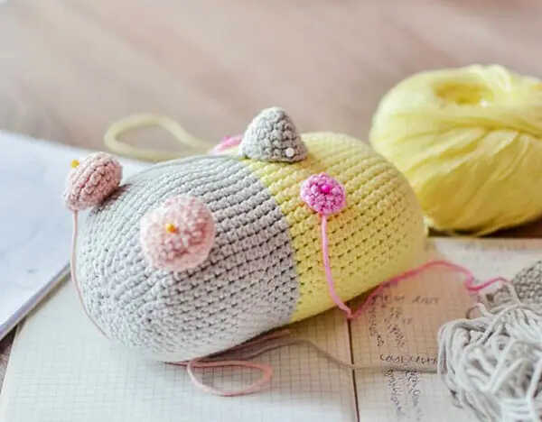 Parrot amigurumi free crochet pattern in progress showing body shaping and stitching details with soft yarn