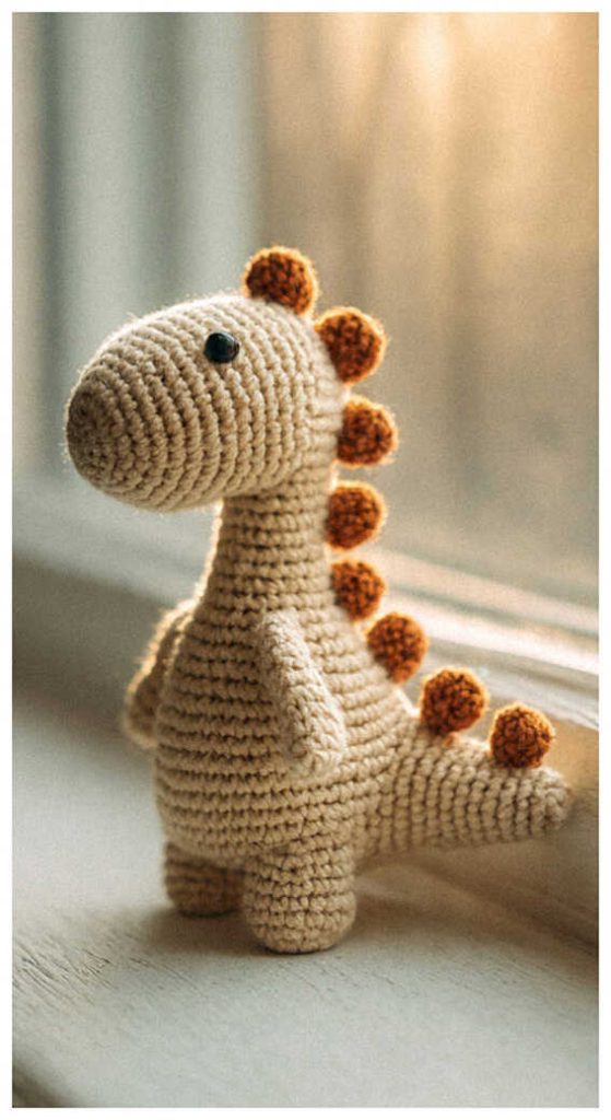 beige dinosaur amigurumi crochet toy small cute baby dino handmade plush gift idea free pattern in link