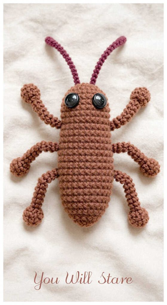 Brown crochet cockroach amigurumi displayed as a quirky handmade decor piece