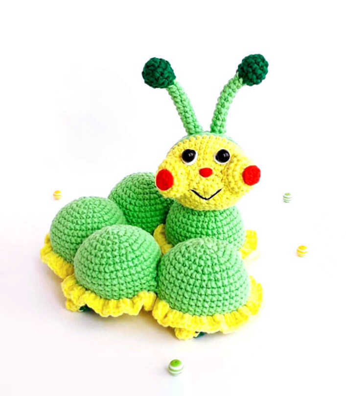 Caterpillar amigurumi crochet plush displayed on a clean bright background