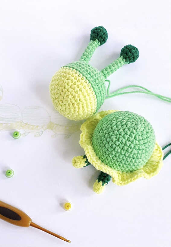 Caterpillar amigurumi crochet assembly stage with body pieces in progress