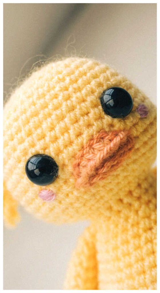Duck amigurumi crochet close up showing facial details