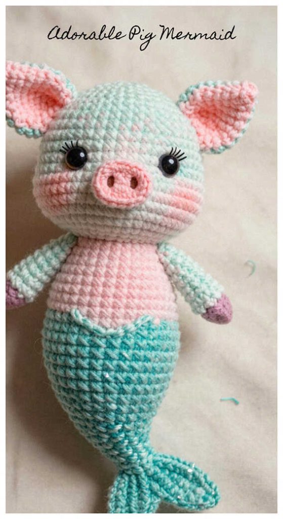 Pastel mermaid pig crochet plush displayed in bright soft lighting