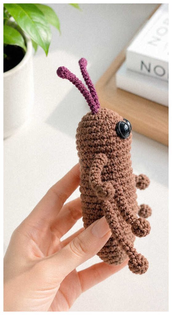 Long legged crochet cockroach plush in a bright modern setting