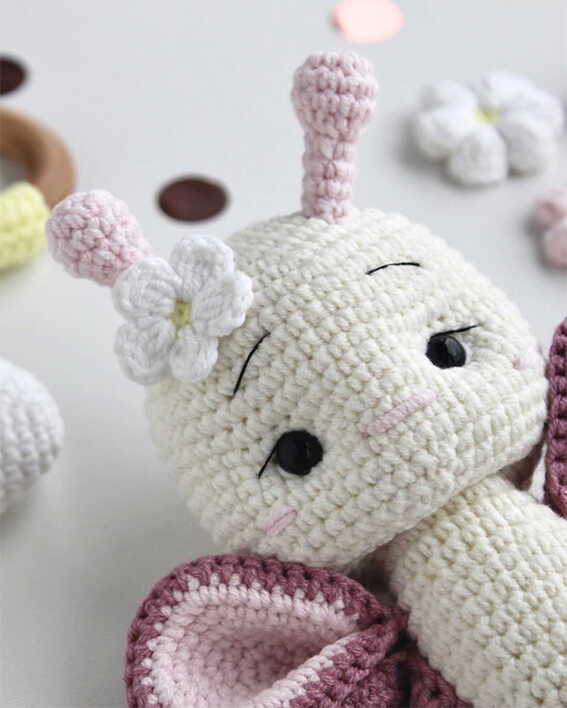 Butterfly amigurumi crochet plush face detail with flower