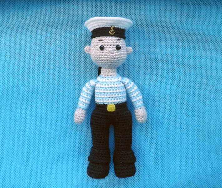 Sailor amigurumi crochet doll in navy uniform